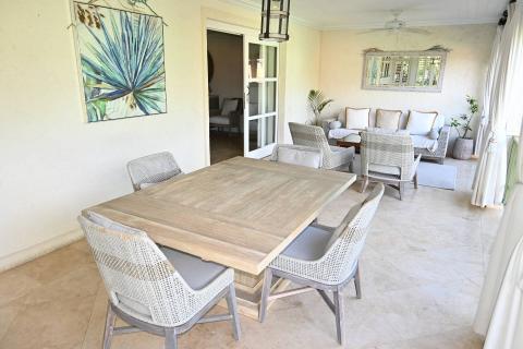 The image shows a stylishly decorated patio area