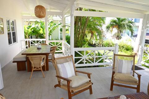 This image shows a stylish outdoor patio area of a house