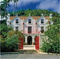 The image shows a picturesque tropical house characterized by its distinct architectural style