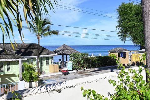 This image captures a serene coastal scene, presumably from a Caribbean or similar tropical location