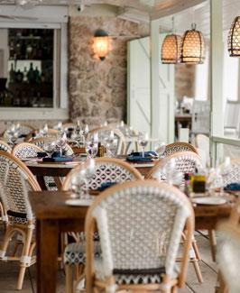 The image features an indoor dining setup likely in a restaurant