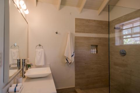 The image depicts a modern bathroom interior
