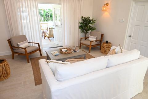 The image shows a bright and well-decorated living room