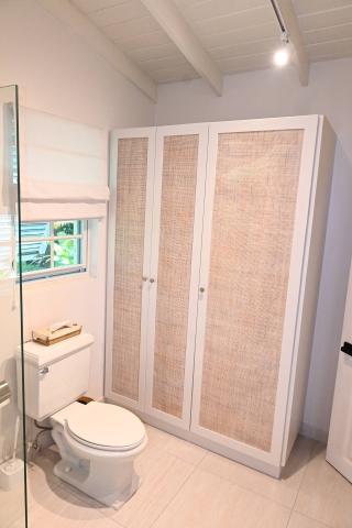 The image shows a modern bathroom with a minimalist design