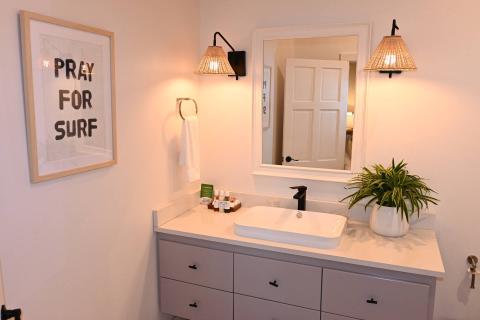 The image shows a stylishly decorated bathroom