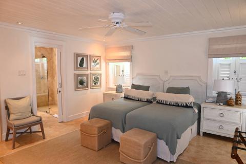 The image shows a well-appointed bedroom