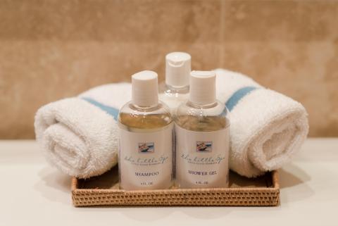 This image features a neatly arranged set of toiletries on a bathroom counter