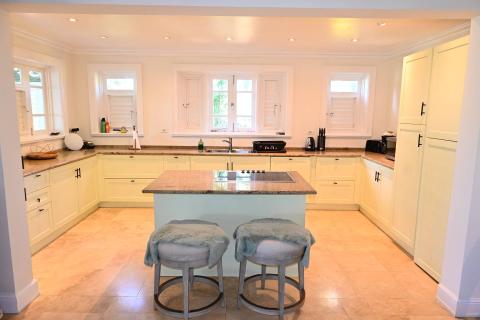 This image shows a spacious kitchen interior