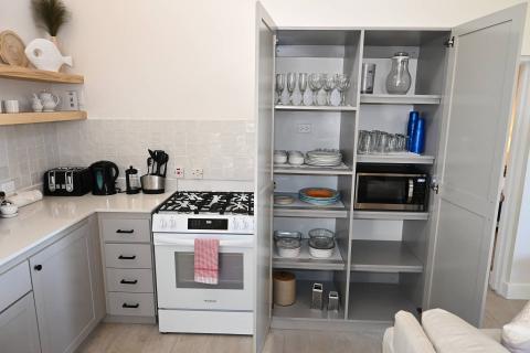 This image depicts a well-organized kitchen area