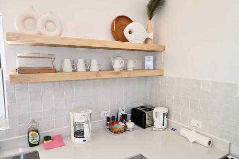 This is an image of a well-organized kitchen counter and shelf