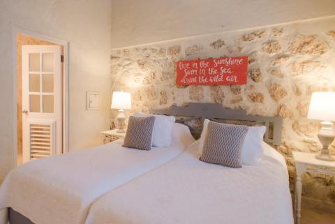 This image shows a cozy bedroom with a rustic charm