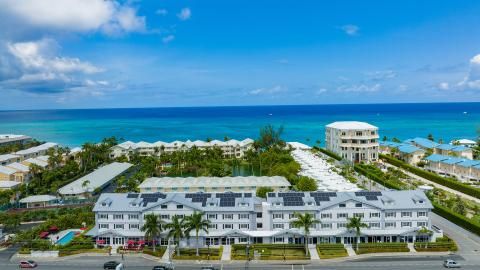 This image showcases a coastal urban scene characterized by modern architecture