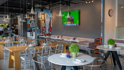 The image shows the interior of a modern cafe or restaurant