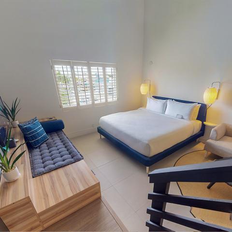 The image depicts a modern and stylish bedroom