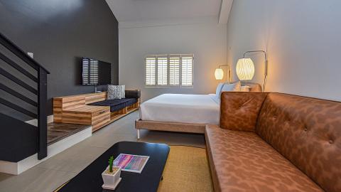 The image depicts a modern bedroom interior