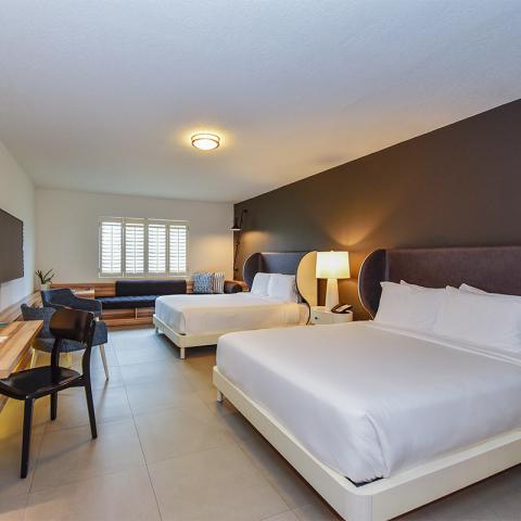 The image shows a neatly arranged hotel room