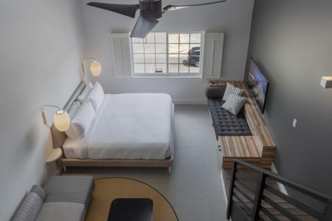 The image shows a well-organized and modern bedroom