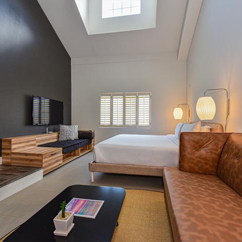 This image features a modern and stylish bedroom