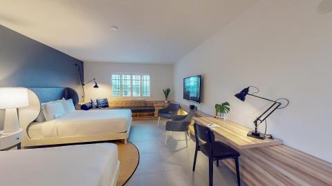 This image shows a modern and well-lit bedroom