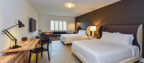 This image shows a modern hotel room or a guestroom