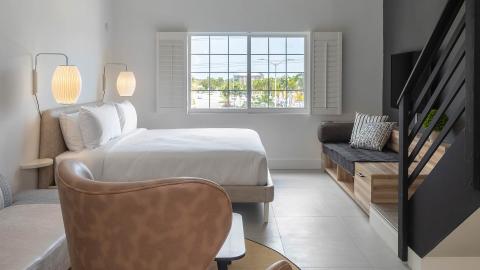 This image shows a modern and neatly arranged bedroom