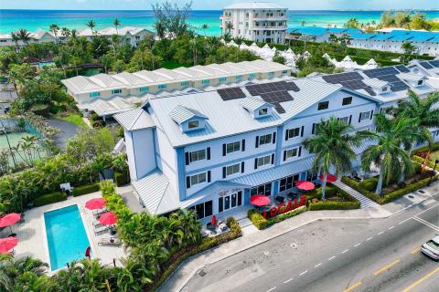 This image captures an aerial view of a coastal resort or hotel area