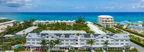 The image showcases a picturesque coastal resort scene