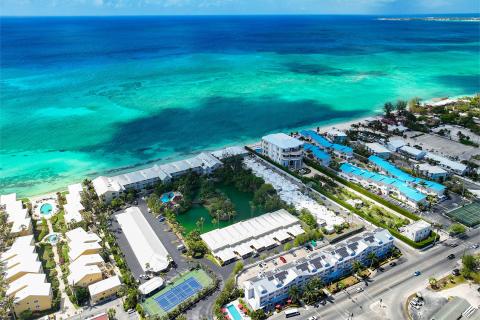 This aerial image showcases a vibrant coastal scene likely from a tropical or subtropical area