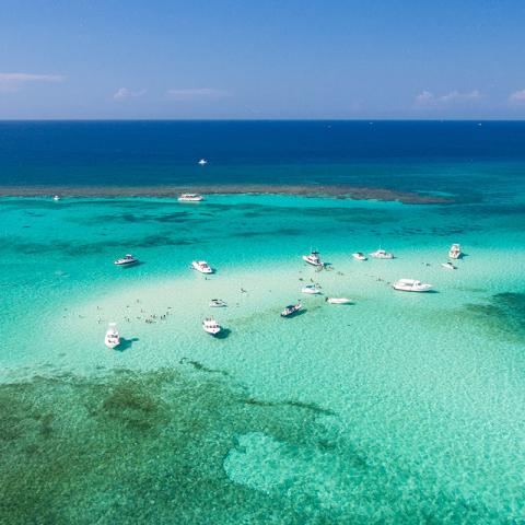 This image shows a stunning aerial view of a tropical beach scene