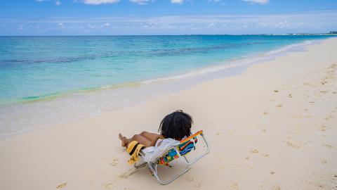 This image features a beautiful, tranquil beach scene
