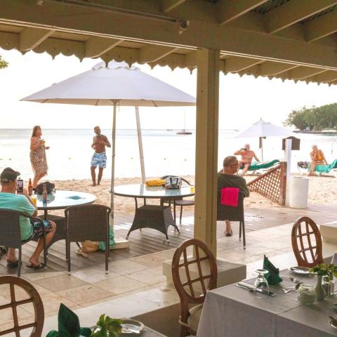 This image shows a beachside restaurant scene