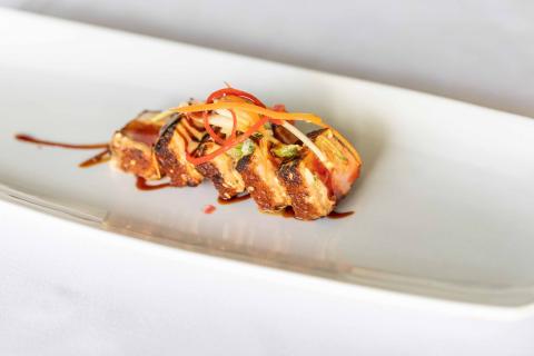 This image features a beautifully presented gourmet dish, likely from a fine dining restaurant