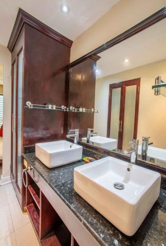 The image shows a bathroom interior featuring a vanity area
