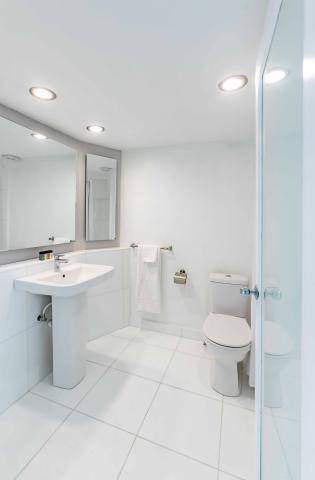 The image shows a clean and modern bathroom interior