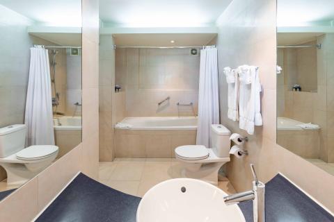 The image shows a well-kept bathroom with a modern and functional design