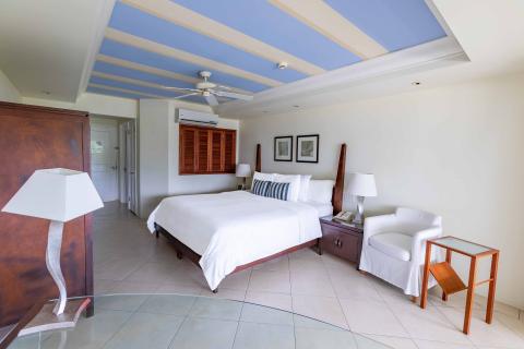 This image depicts a modern and well-furnished bedroom