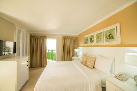 This image shows a well-lit, neatly arranged hotel room