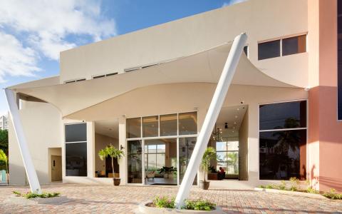 This image shows a modern building with an architectural design characterized by clean lines and unique structural elements