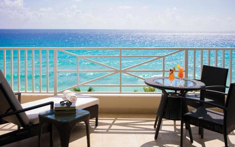 This is an image of a pleasant and inviting beachfront balcony scene