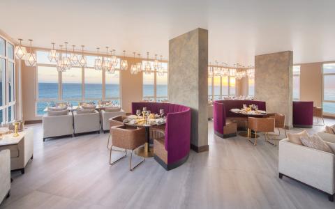 This image depicts a sophisticated and elegantly designed dining area in a restaurant