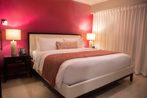 The image displays a well-decorated bedroom interior