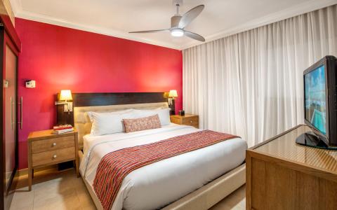 The image shows a modern hotel room