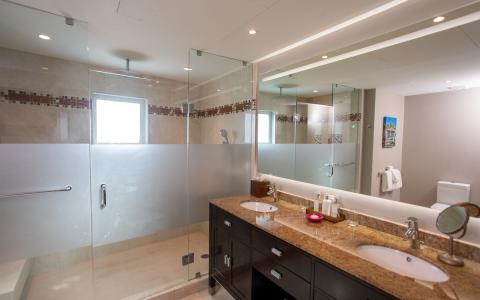 The image shows a modern, spacious bathroom