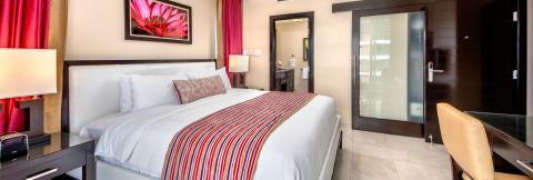 This image displays a modern hotel room