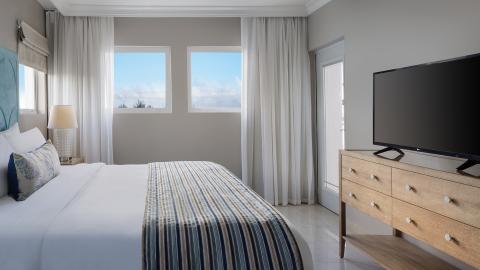 This image shows a clean and modern bedroom