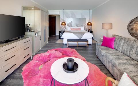 This image shows a modern hotel room or a stylish apartment bedroom