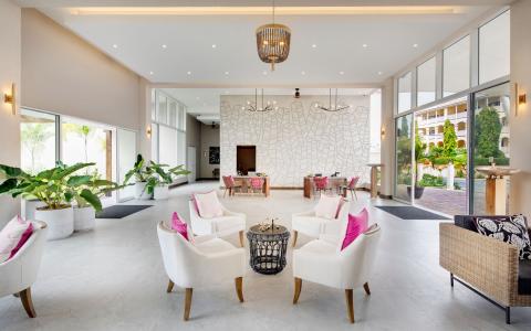 This image depicts a stylish and modern hotel lobby or a similar hospitality venue
