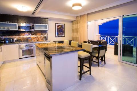This image shows a modern and well-appointed kitchen and dining area