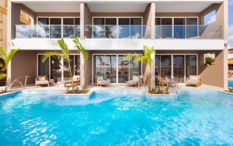 This image features a modern, luxurious hotel or resort area