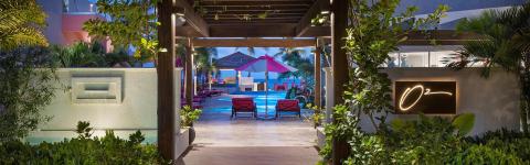 This image captures a picturesque evening view of a luxurious resort setting